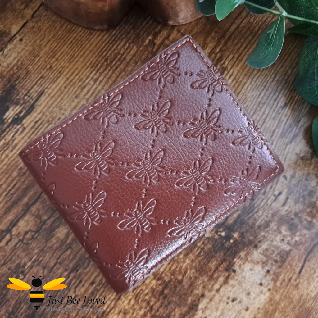 Brown leather wallet with embossed all over bees criss-cross pattern design.