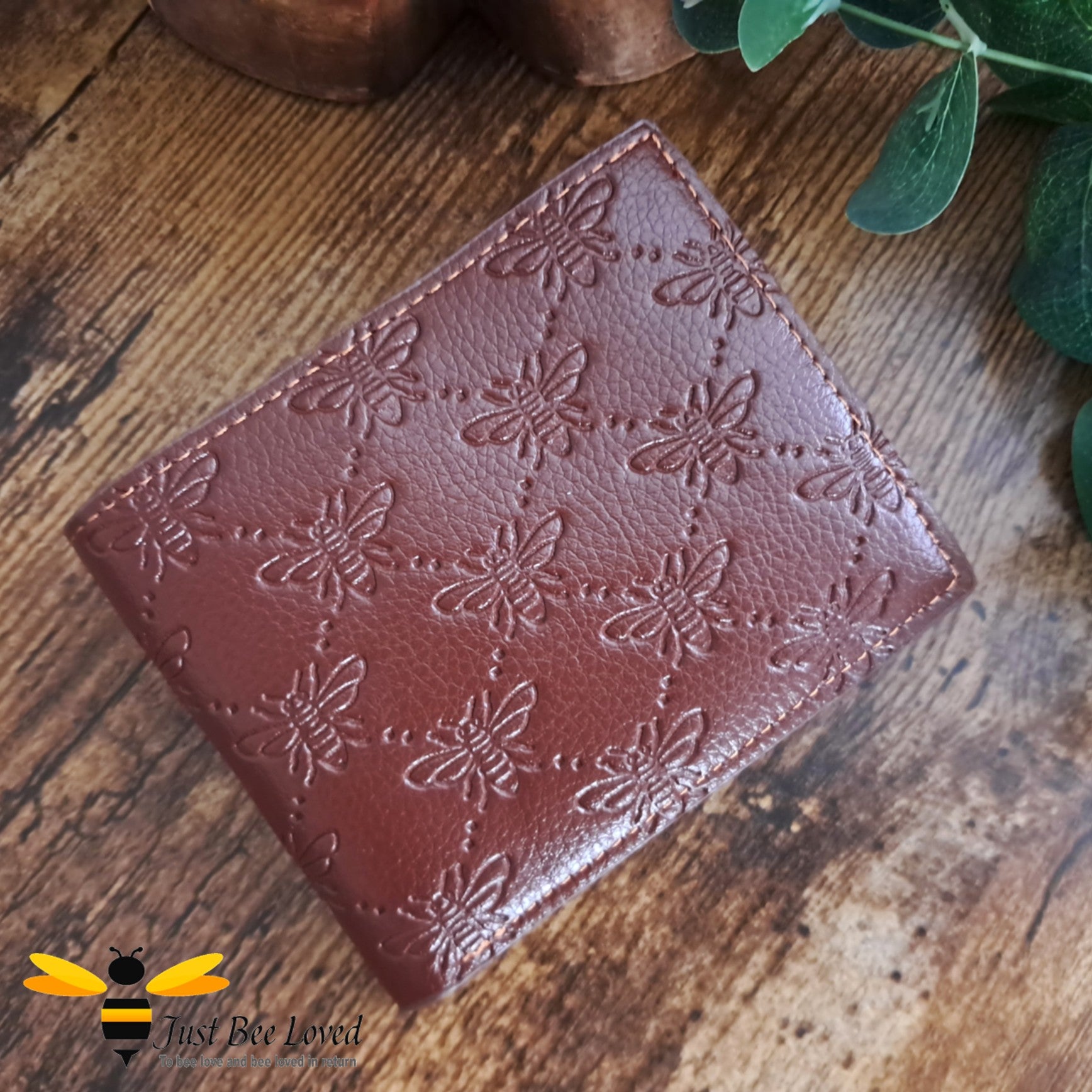 Brown leather wallet with embossed all over bees criss-cross pattern design.