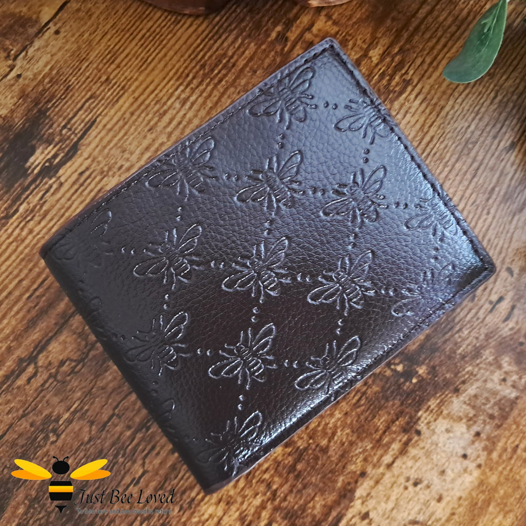 Dark brown leather wallet with embossed all over bees criss-cross pattern design.
