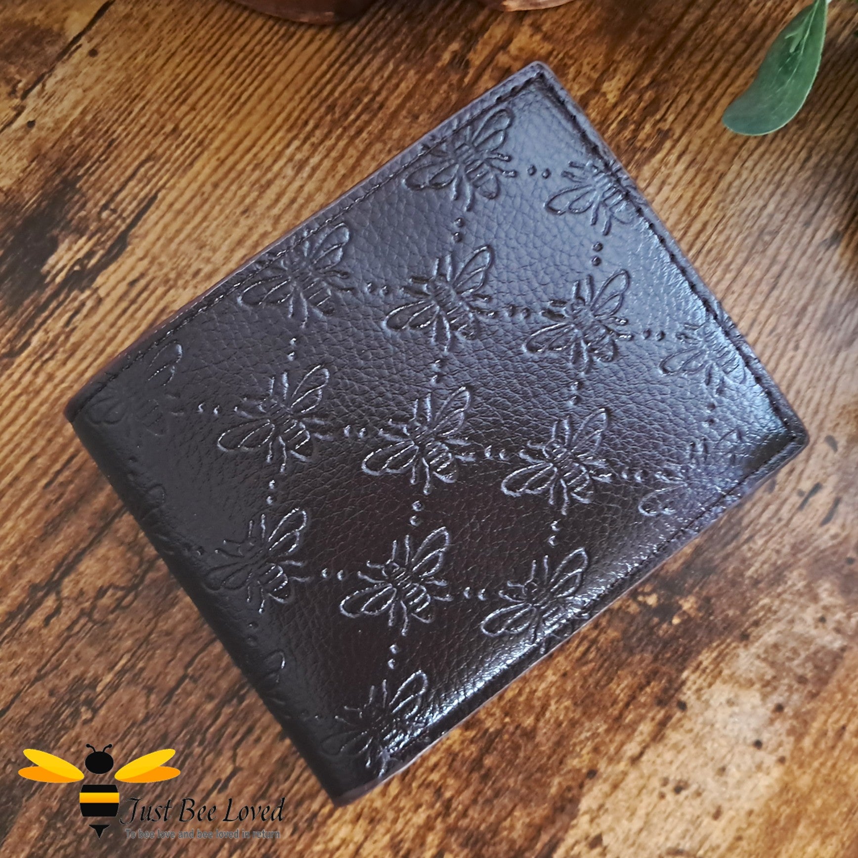 Dark brown leather wallet with embossed all over bees criss-cross pattern design.
