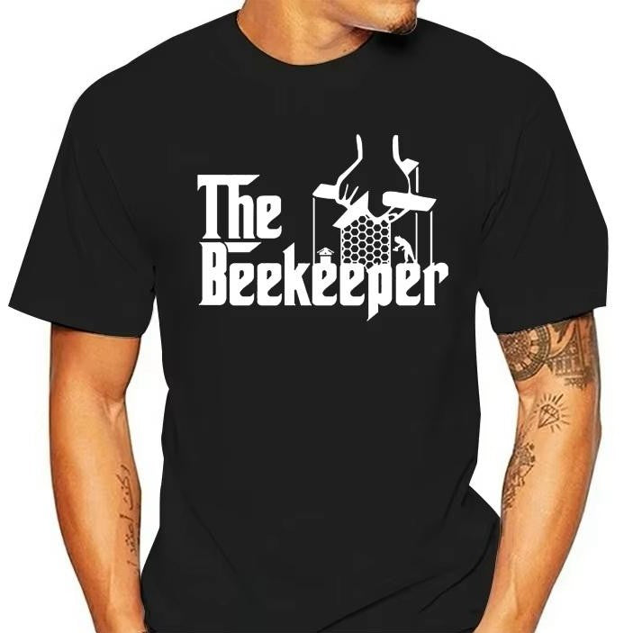 A black t-shirt with 'THE BEEKEEPER' text and a graphic spoofing 'The Godfather's' iconic puppet master scene.