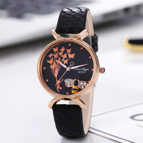 Ladies black leather watch with an encased moving bee charm