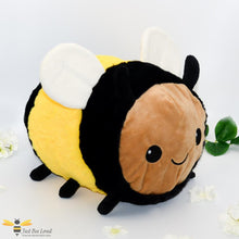 Load image into Gallery viewer, A medium sized plush soft toy bee with a smiling face.