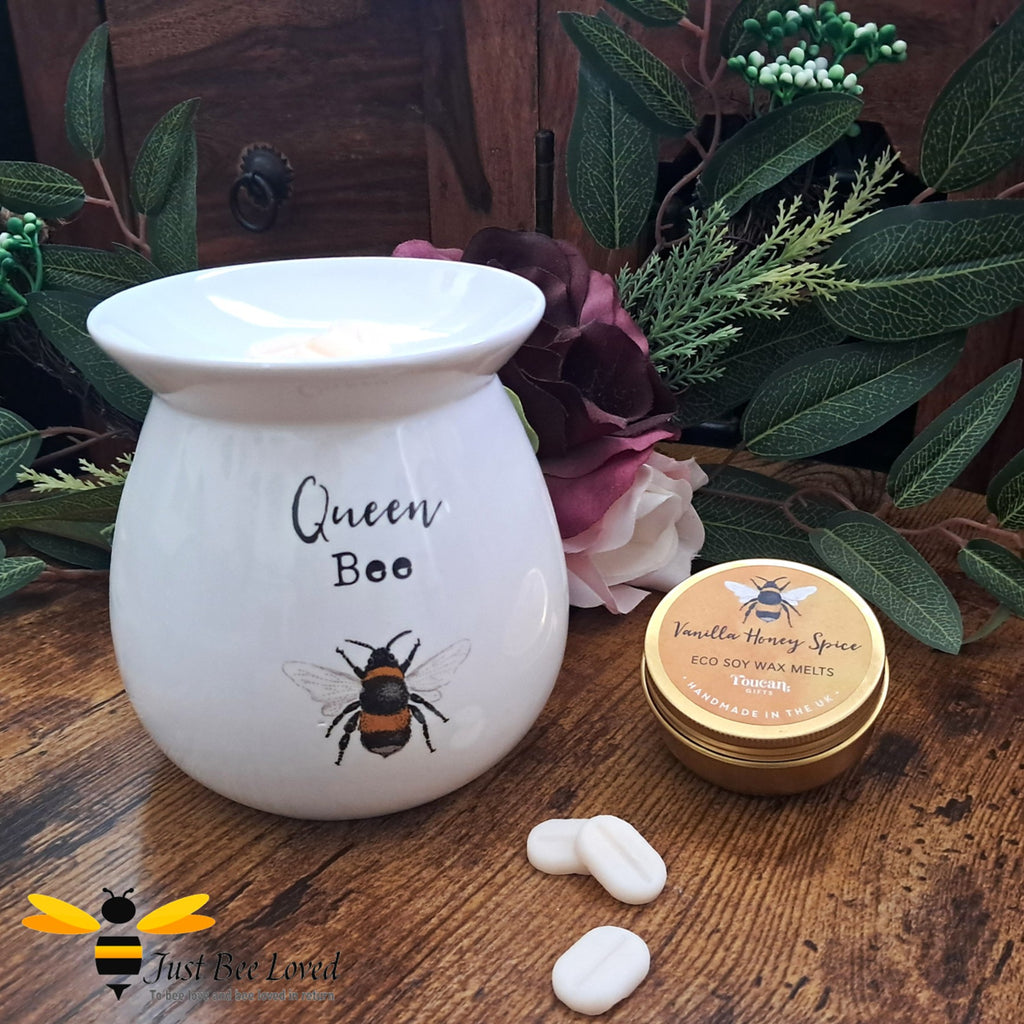 Wax warmer with 'Queen Bee' text and a bee illustration, with a tin of wax melts