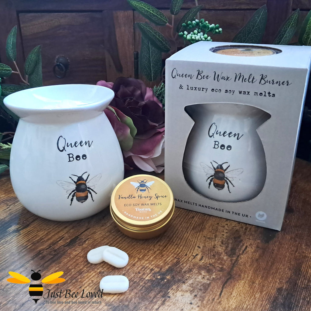 Wax warmer with 'Queen Bee' text and a bee illustration, with a tin of wax melts