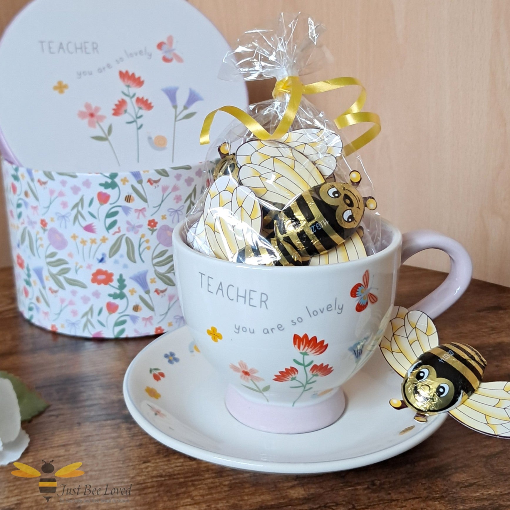 Tea cup and saucer gift set with 'Teacher you are so lovely' text, filled with novelty bee chocolate treats.