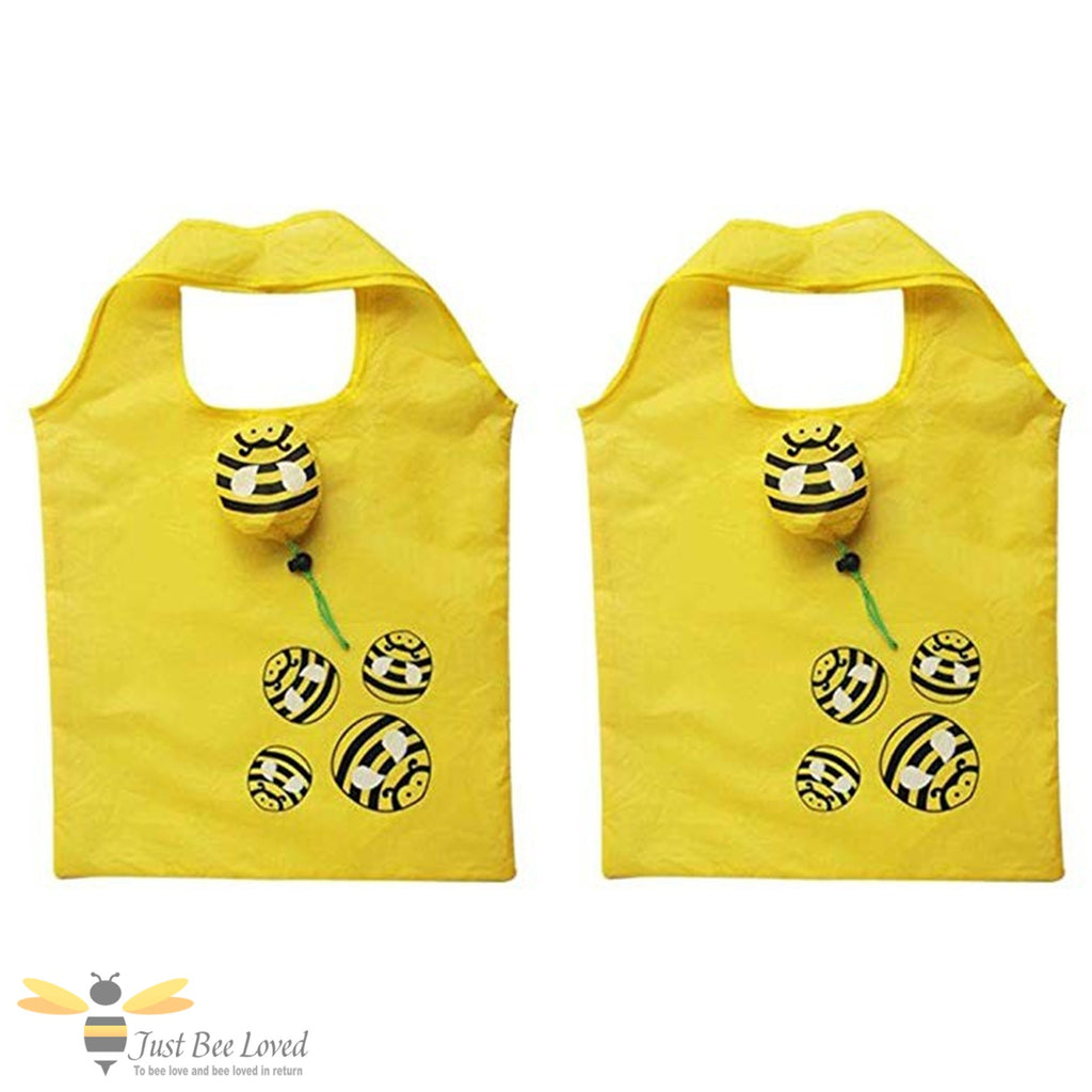Two yellow foldable bags with bee designs with carry pouch.