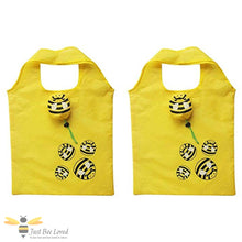 Load image into Gallery viewer, Two yellow foldable bags with bee designs with carry pouch.