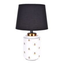 Load image into Gallery viewer, white ceramic table lamp features an all over pattern of bumble bees with black cotton shade