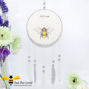 Handmade wooden dream catcher with bumble bees, purple flowers, crystals