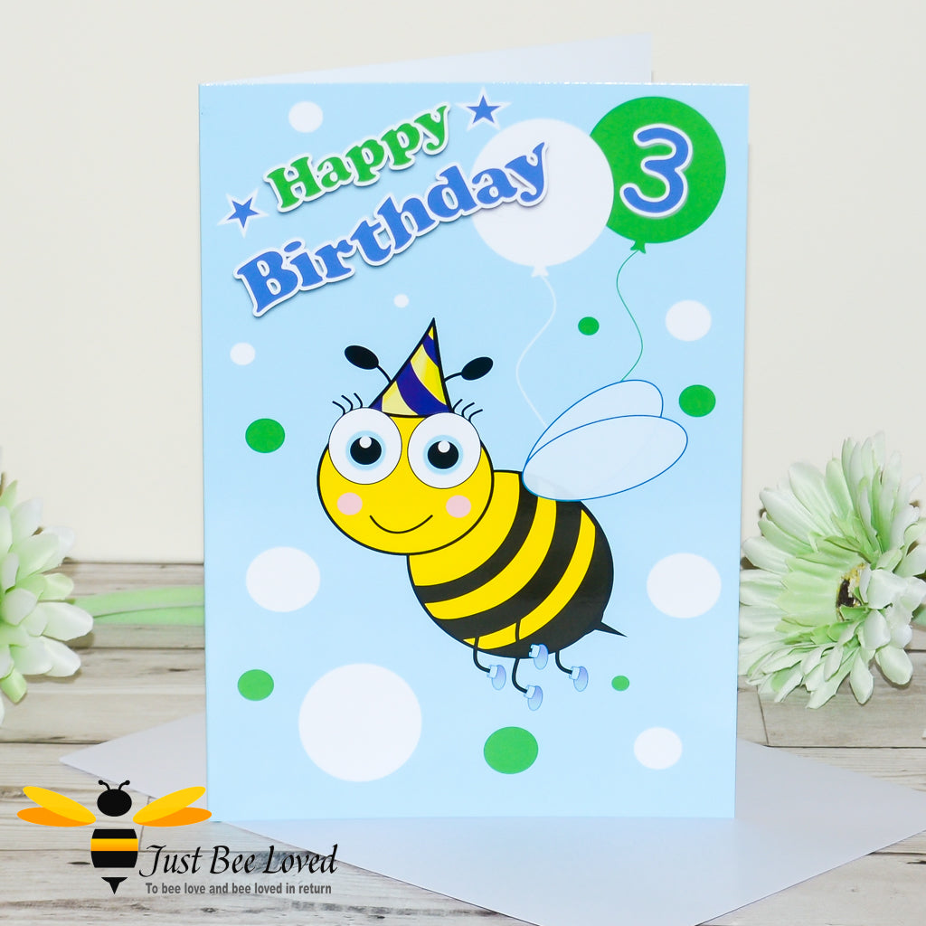 3rd birthday greeting bee card featuring a cartoon bee wearing a party hat and holding a balloon with the number 3.