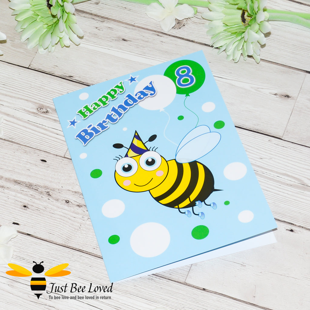 a blue birthday greeting card featuring a cartoon bee wearing a party hat and holding a balloon with the number 8.