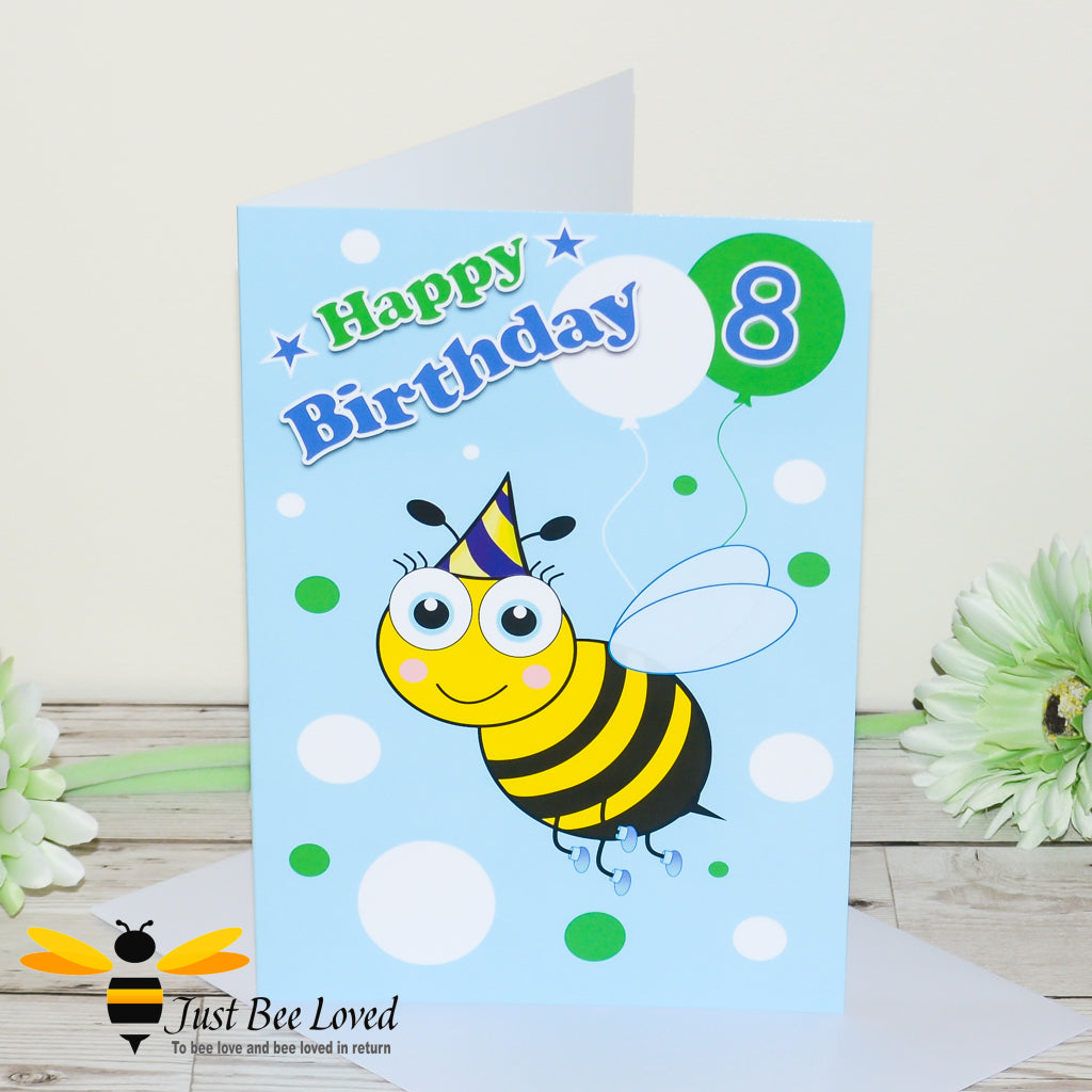image of a bee themed blue birthday card showing a cartoon bee illustration, balloons and the number 8.