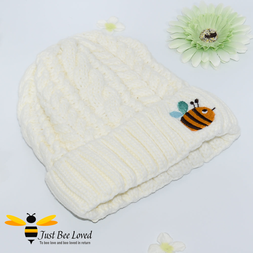 Aran style knitted hat with embroidery bee in cream colour