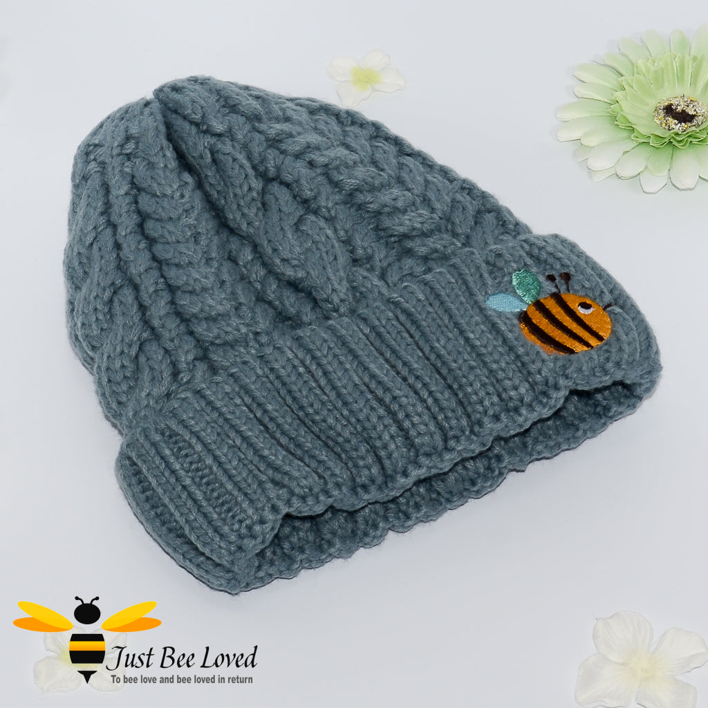Aran style knitted hat with embroidery bee in grey colour