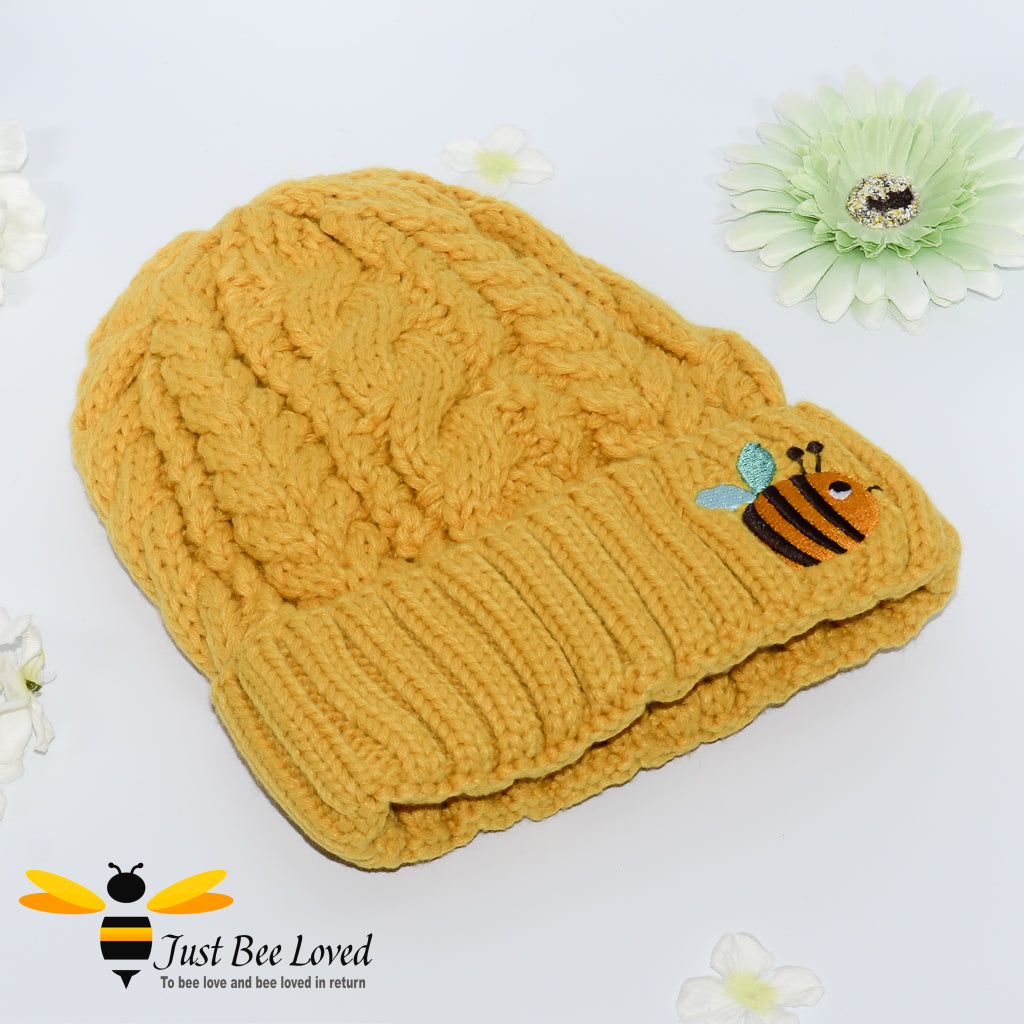 Aran style knitted hat with embroidery bee in mustard colour
