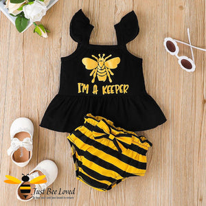 baby girl 2-piece set featuring frilly vest top with "I'm a Keeper" text & honey bee image, matched with black and yellow striped bloomer knickers. 
