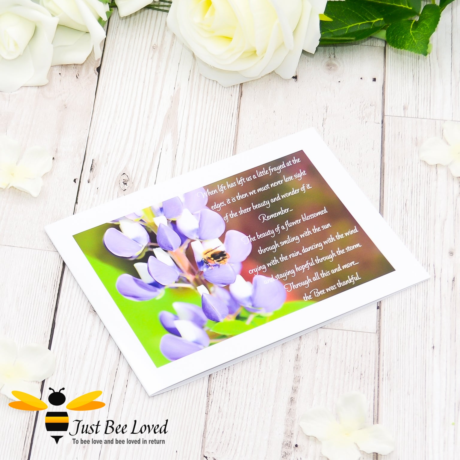 a greeting card showing a landscape photographic print of a wild bee foraging on purple lupine flowers with an accompanying inspirational verse.