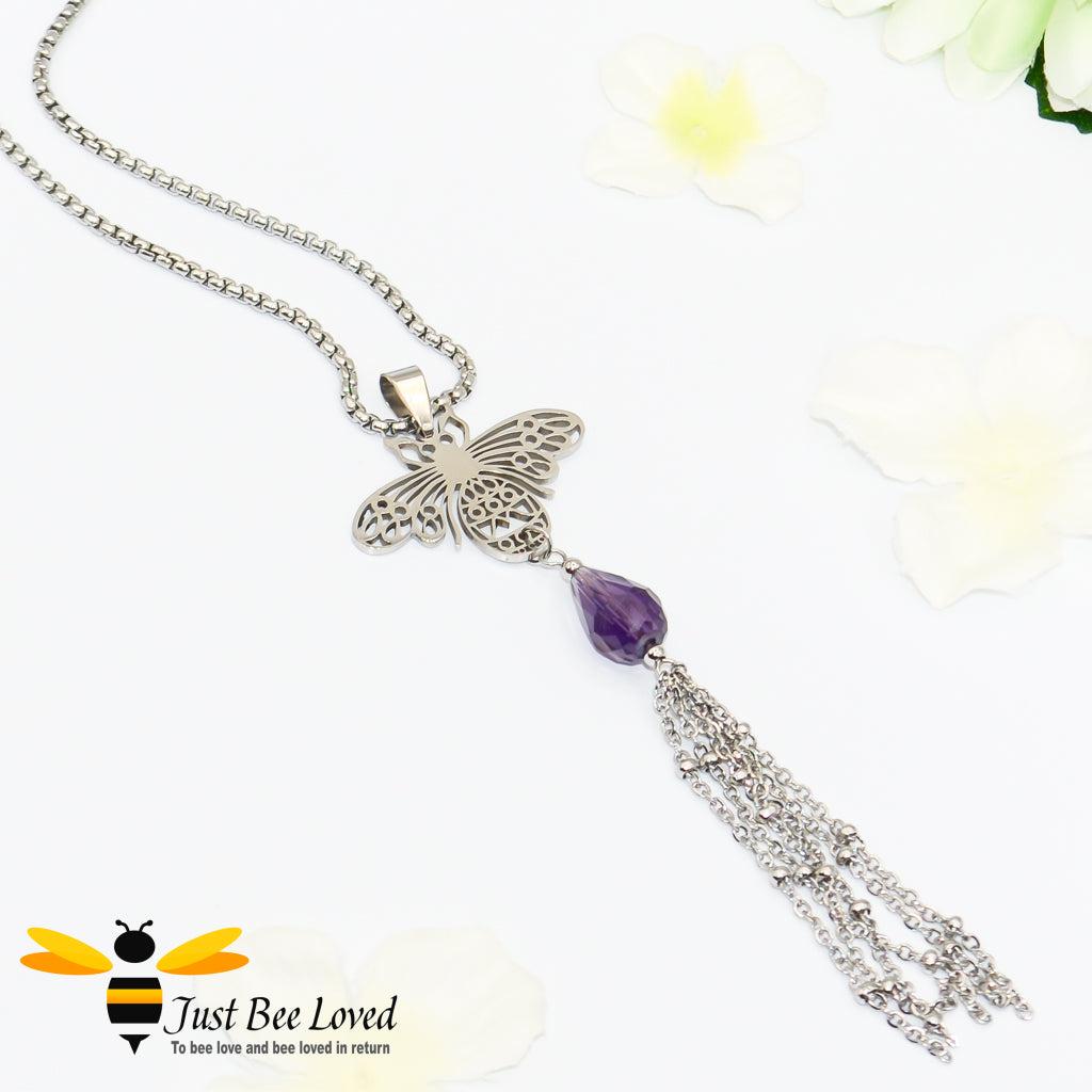 silver colour necklace with a bee pendant, purple crystal and tassels