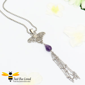 statement necklace featuring a bee pendant, purple crystal and tassel