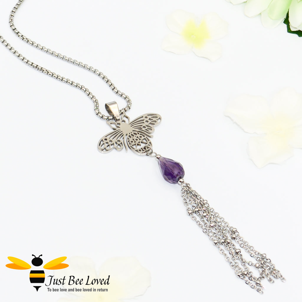 statement necklace featuring a bee pendant, purple crystal and tassel