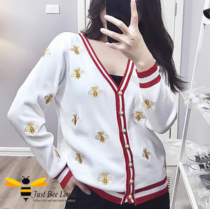 Woman wearing White & red stripe cardigan with bee embroidery design