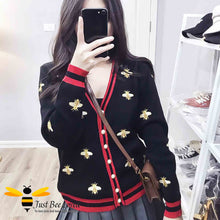 Load image into Gallery viewer, Woman wearing black cardigan with bee embroidery