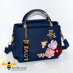 hand-crafted 3D embellished PU leather shoulder handbag featuring a cluster bouquet of colourful flowers, golden leaves with a pearl bee in navy colour