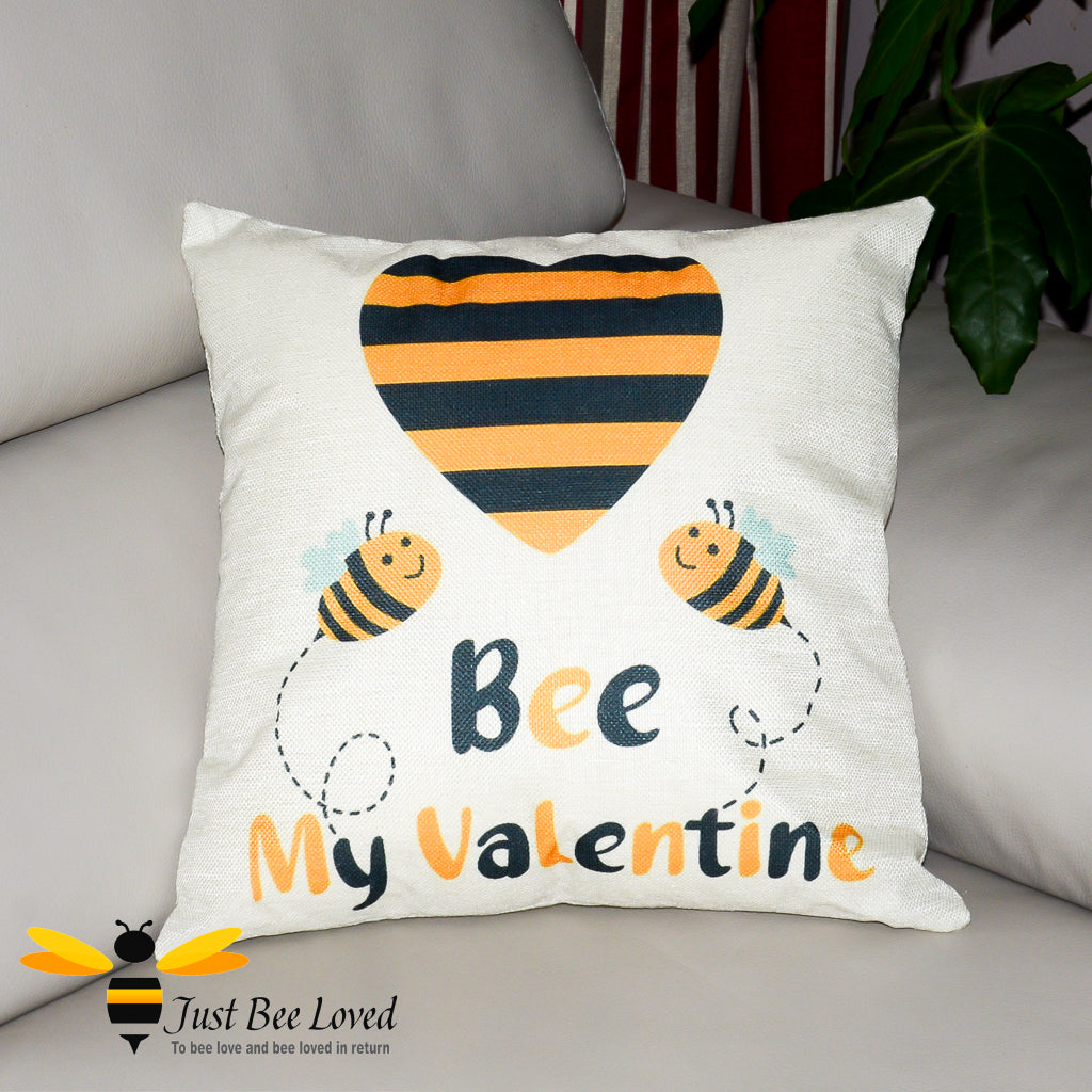 Cream scatter cushion showing two bees in love with "Bee my Valentine" calligraphy.