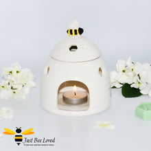 Load image into Gallery viewer, white ceramic wax melt &amp; oil burner designed in the shape of a beehive with removable lid featuring a honey bee