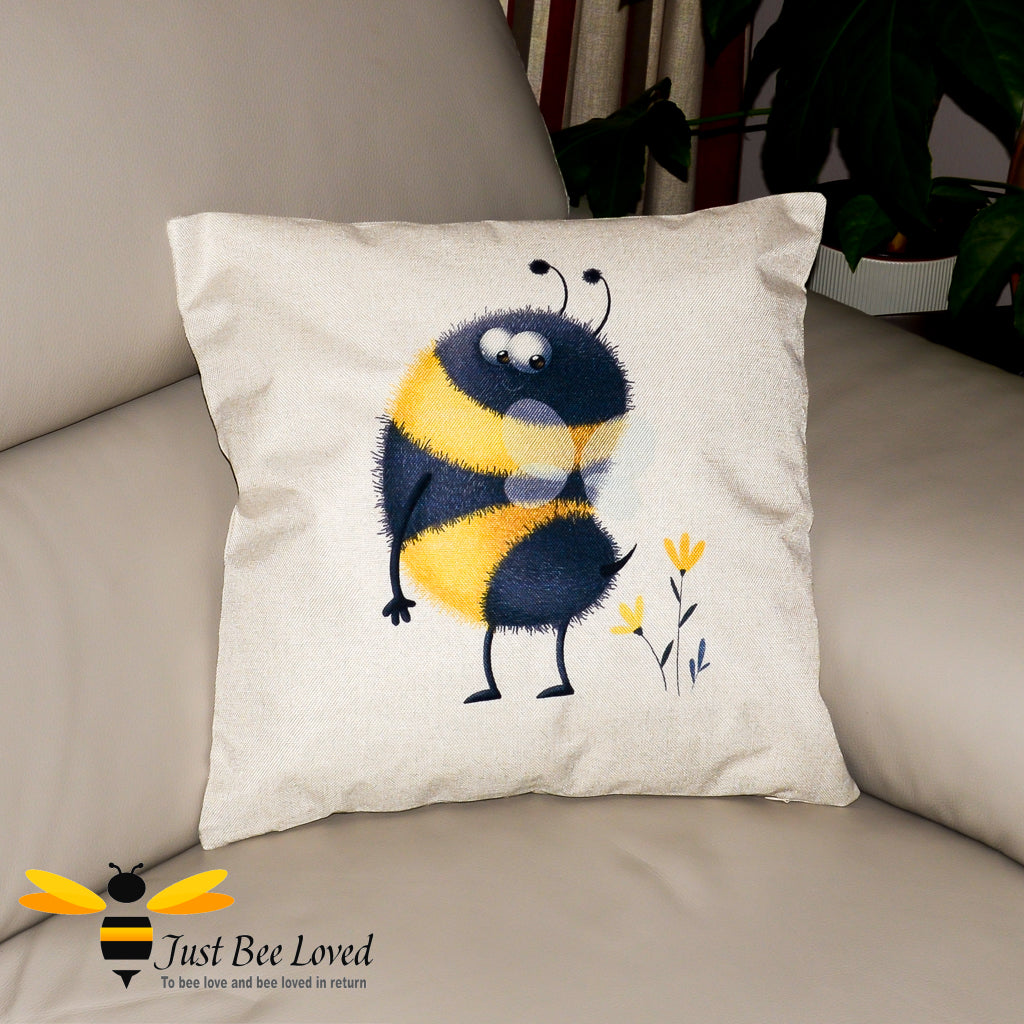 Beige coloured scatter cushion featuring an image of a bumblebee looking at his stinger tail.