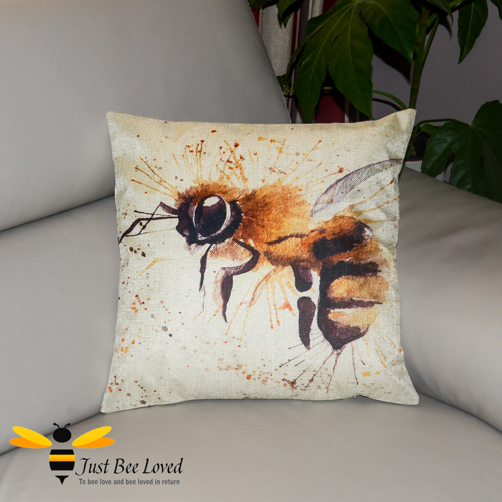 Beige Scatter cushion featuring a watercolour image of a honey bee against splash background