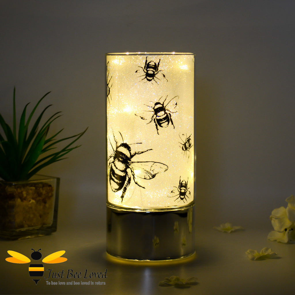 a led light tube table lamp with a bumble bee design.