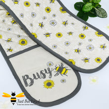 Load image into Gallery viewer, double oven pot holder glove in natural beige featuring an all over bumblebees and daisies design.