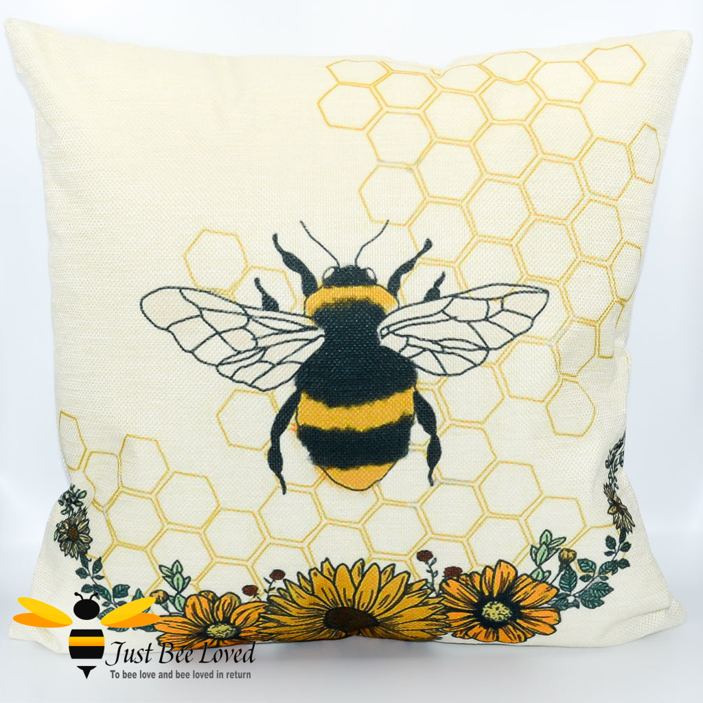 Cream scatter cushion featuring a bumblebee entwinned in hexagonal background with orange sunflowers.