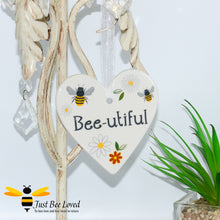 Load image into Gallery viewer, 3 ceramic hanging heart plaques with bees and daisies with &quot;beautiful&quot; sentiment