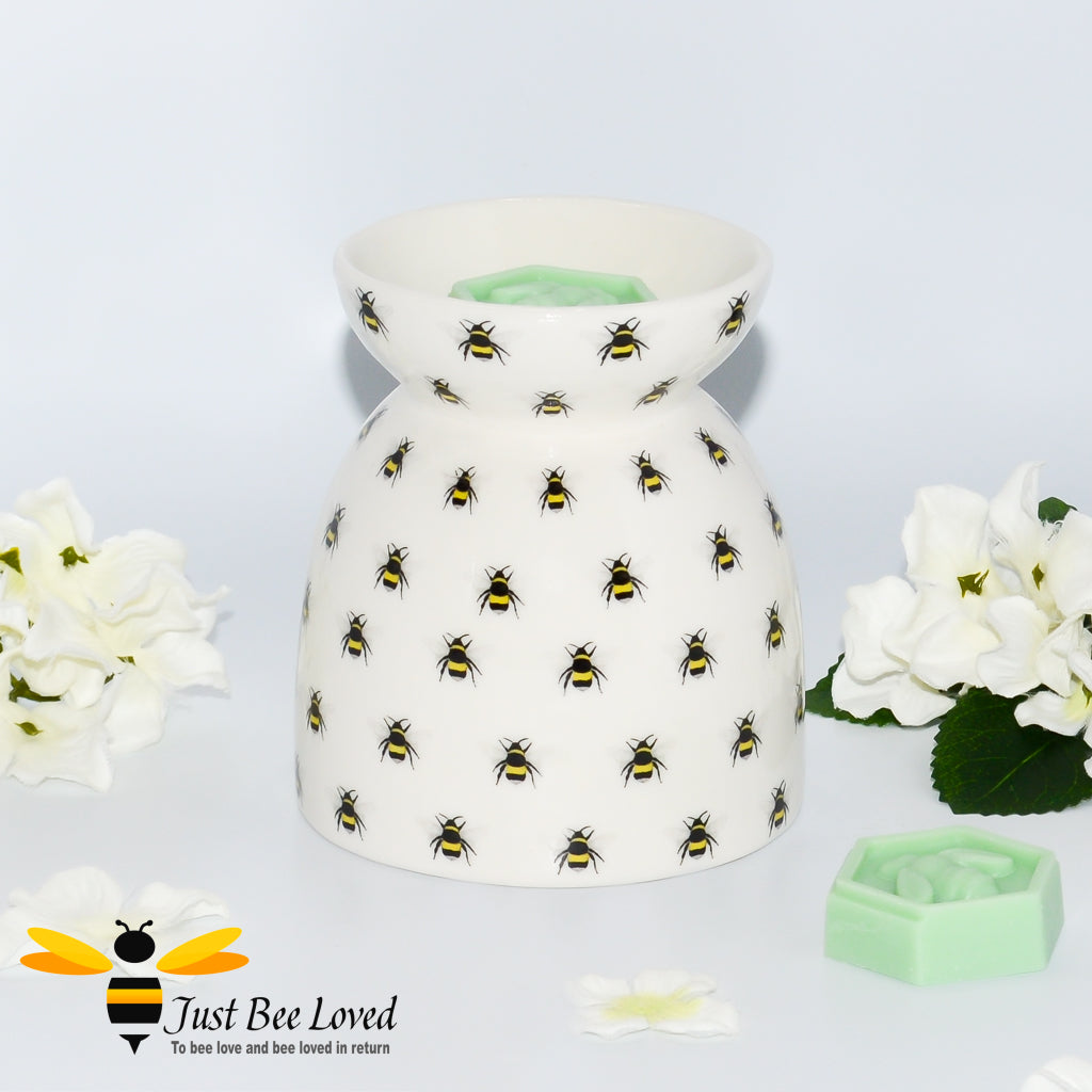 cream ceramic wax warmer & oil burner featuring an all over print of bumblebees with honeycomb tea-light window