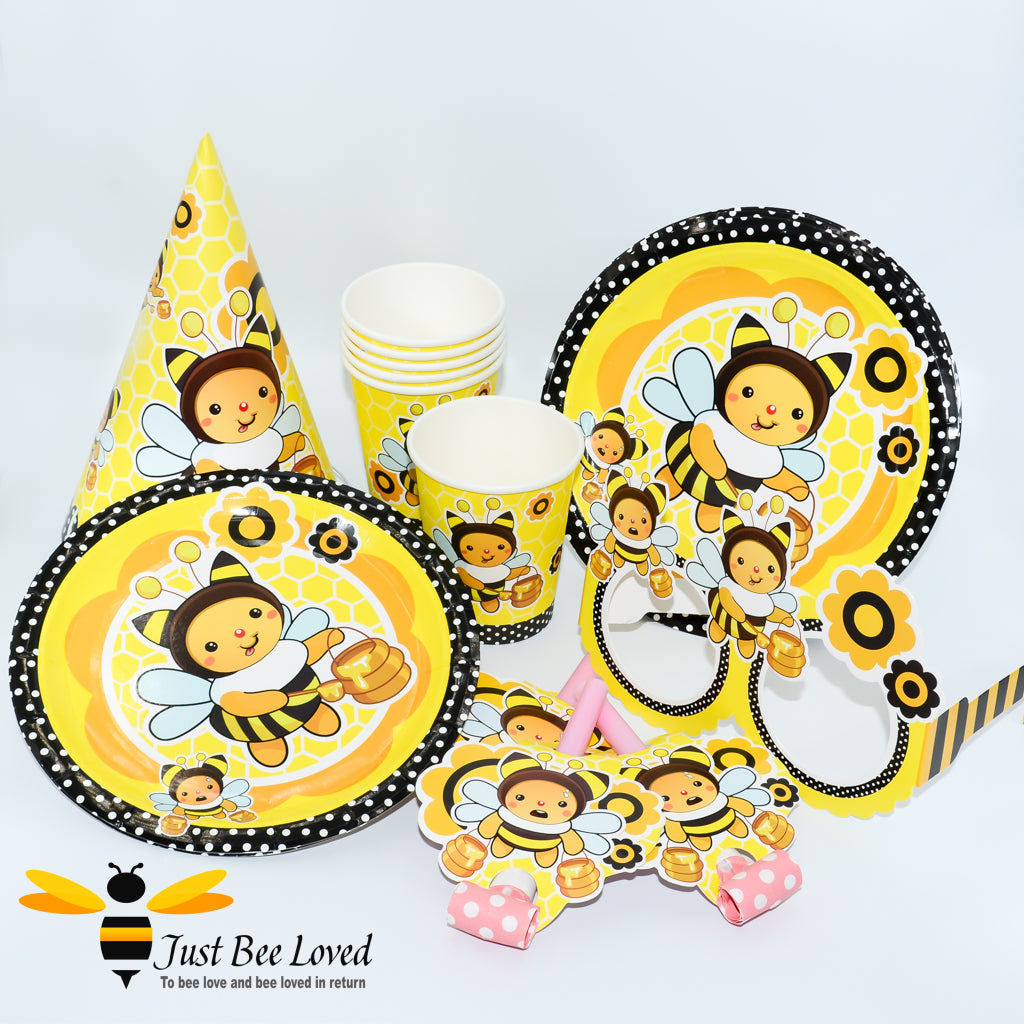 Bee themed tableware set featuring plates, cups, party hats, blow whistles and novelty glasses.