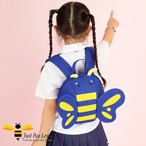 Girl wearing a blue bee backpack bag