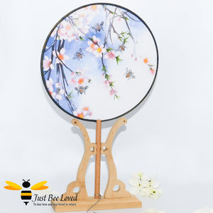 Hand painted vintage Chinese round hand fan on display stand decorated with bees birds and flowers