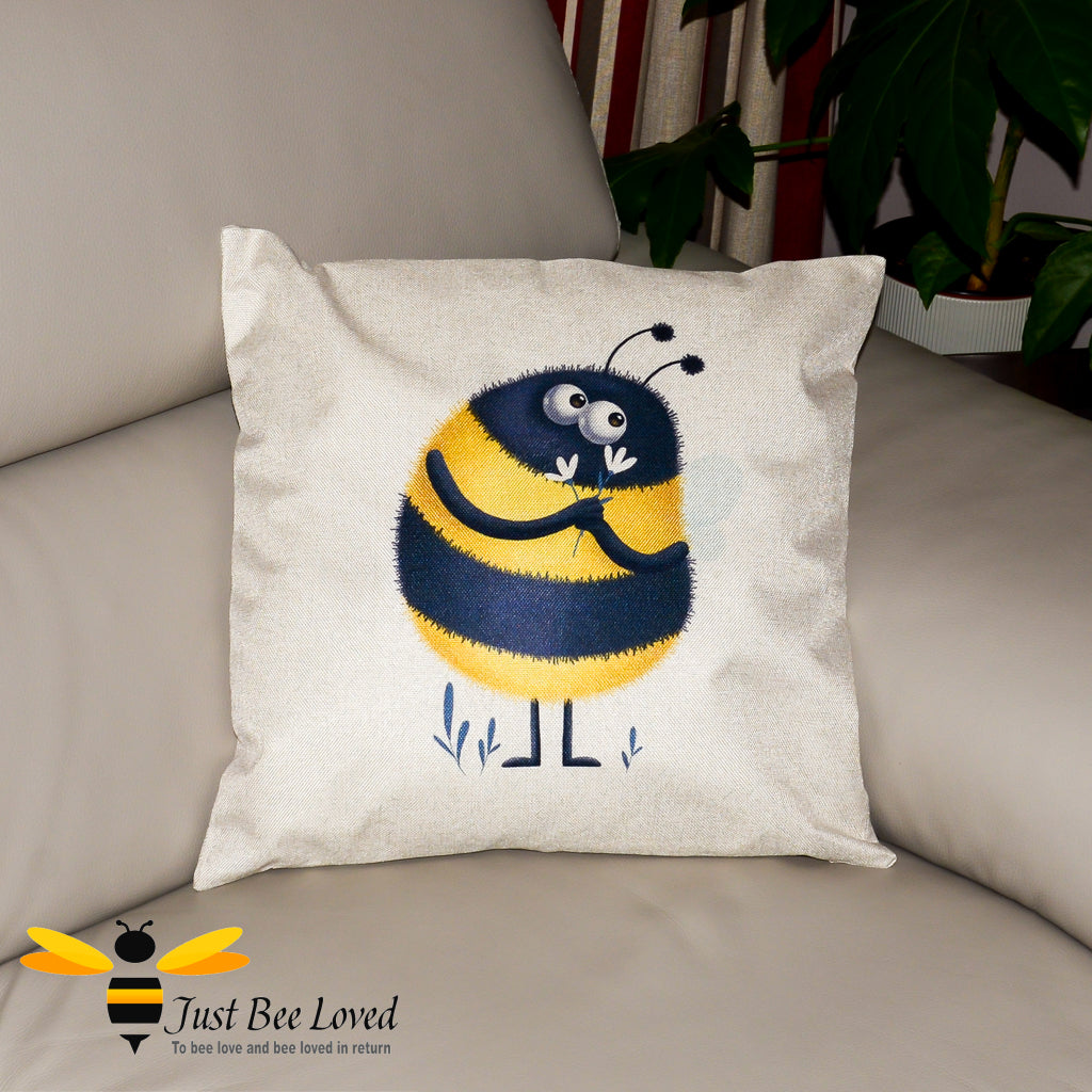 Beige sofa cushion featuring an image of a bumblebee holding daisy flowers.