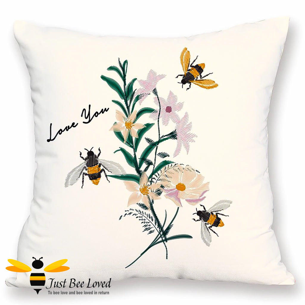 cream scatter cushion with embroidered effect image of bumblebees, flowers and "Love You" calligraphy.