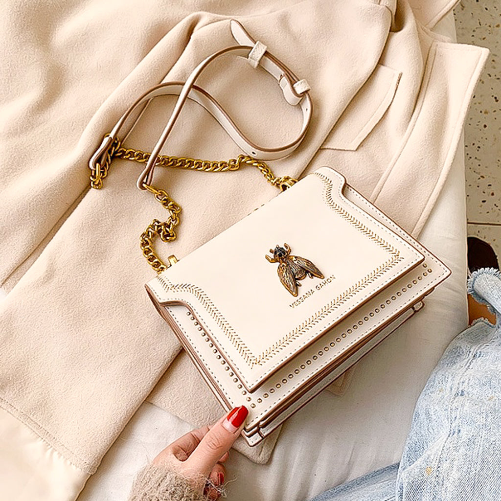 Faux leather cream handbag with large bee decoration