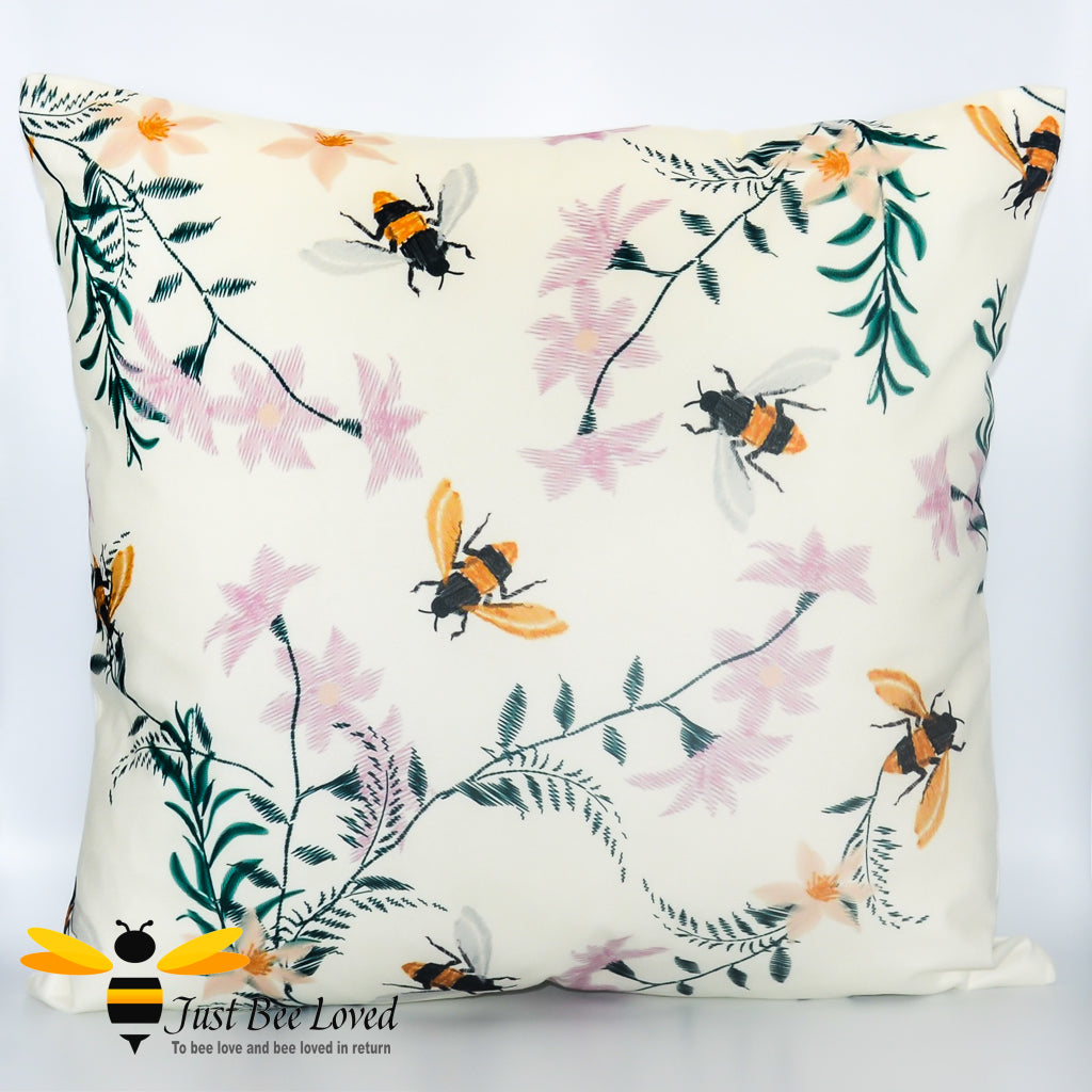 Cream coloured scatter cushion featuring an embroidery design of foraging bees and flowers.