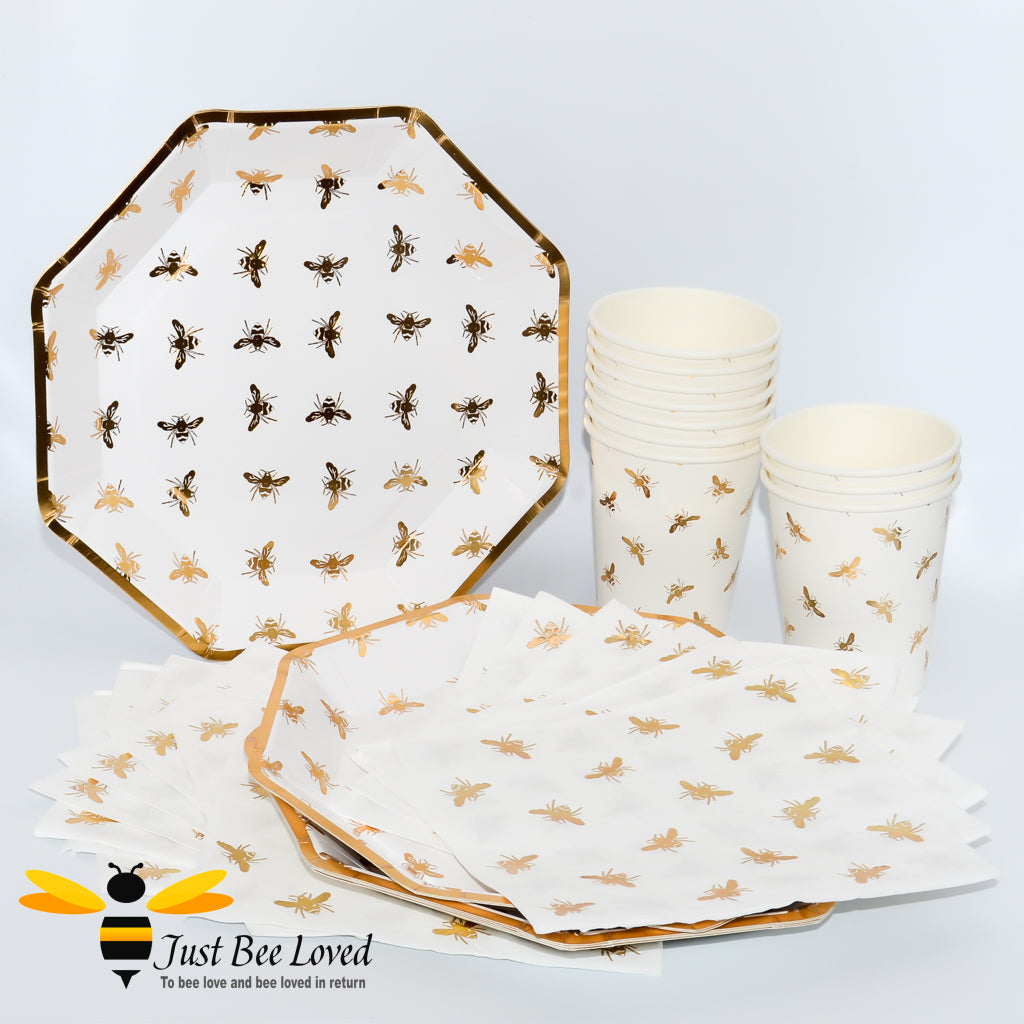 white and gold 35 piece tableware party set includes plates, napkins and cups. Features an all over design of golden bees
