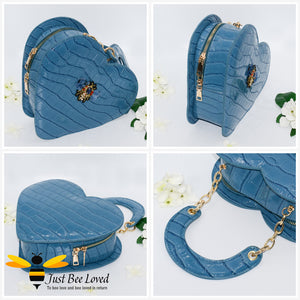 Blue faux patent leather heart-shaped handbag featuring embossed crocodile skin, detailed with a handmade crystal bee at its centre