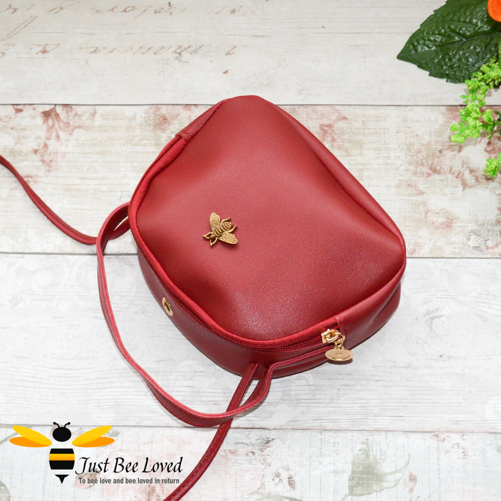 Just Bee Loved Small PU Leather cross body handbag with gold bee embellishment available in four colours, black, burgundy, grey, pink