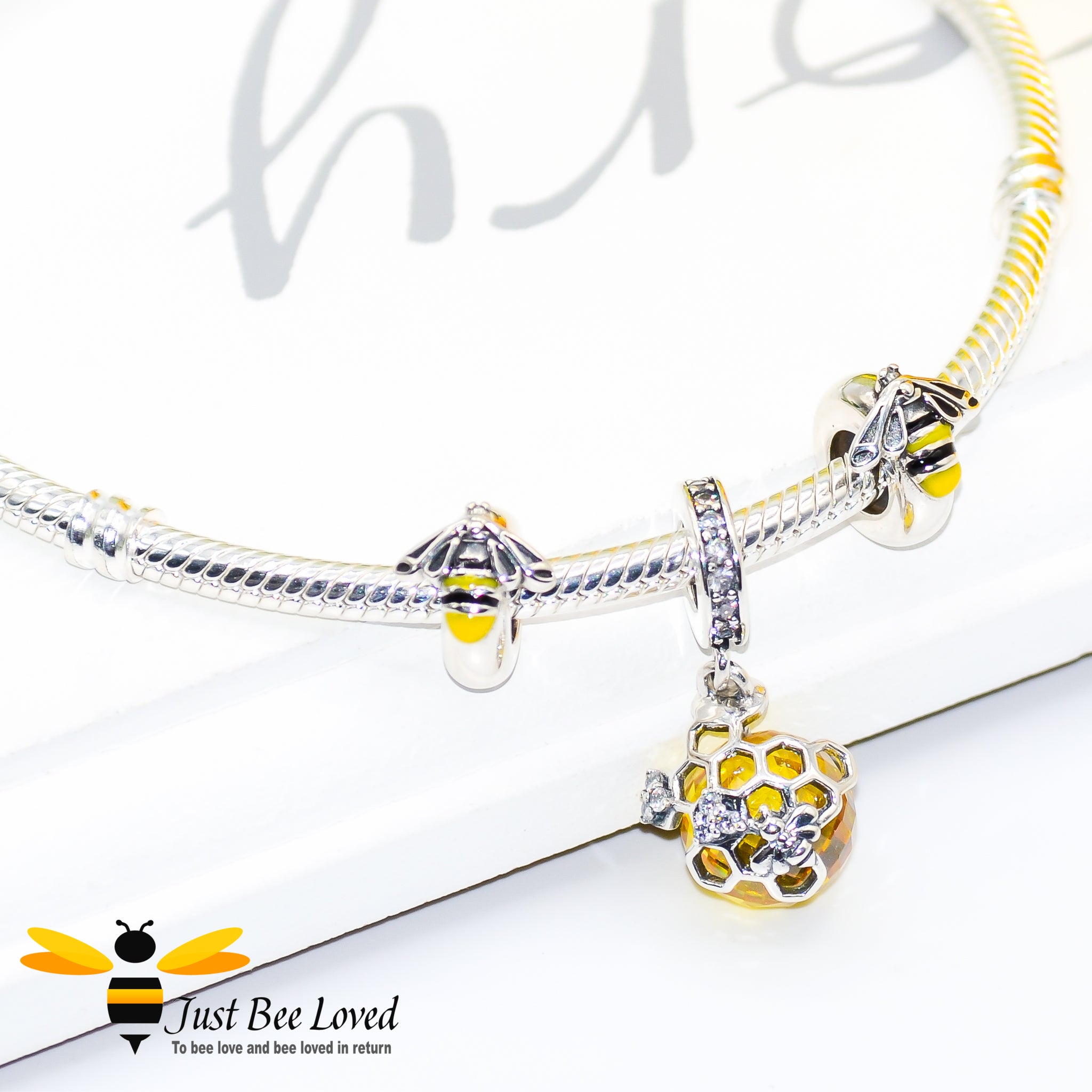 Sterling Silver 925 snake charm bracelet with two enamelled silver  bee charms and honeycomb crystal ball pendant