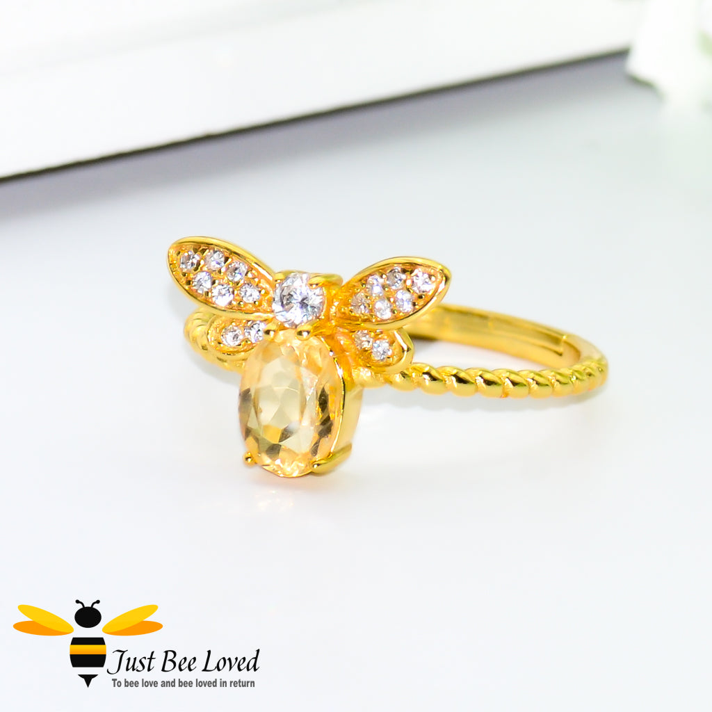 Sterling silver 14k Gold plated bee ring featuring an Oval Citrine gemstone and diamond like cubic zircon crystals.