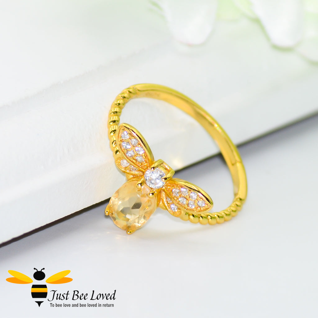Sterling silver 14k Gold plated bee ring featuring an Oval Citrine gemstone and diamond like cubic zircon crystals.